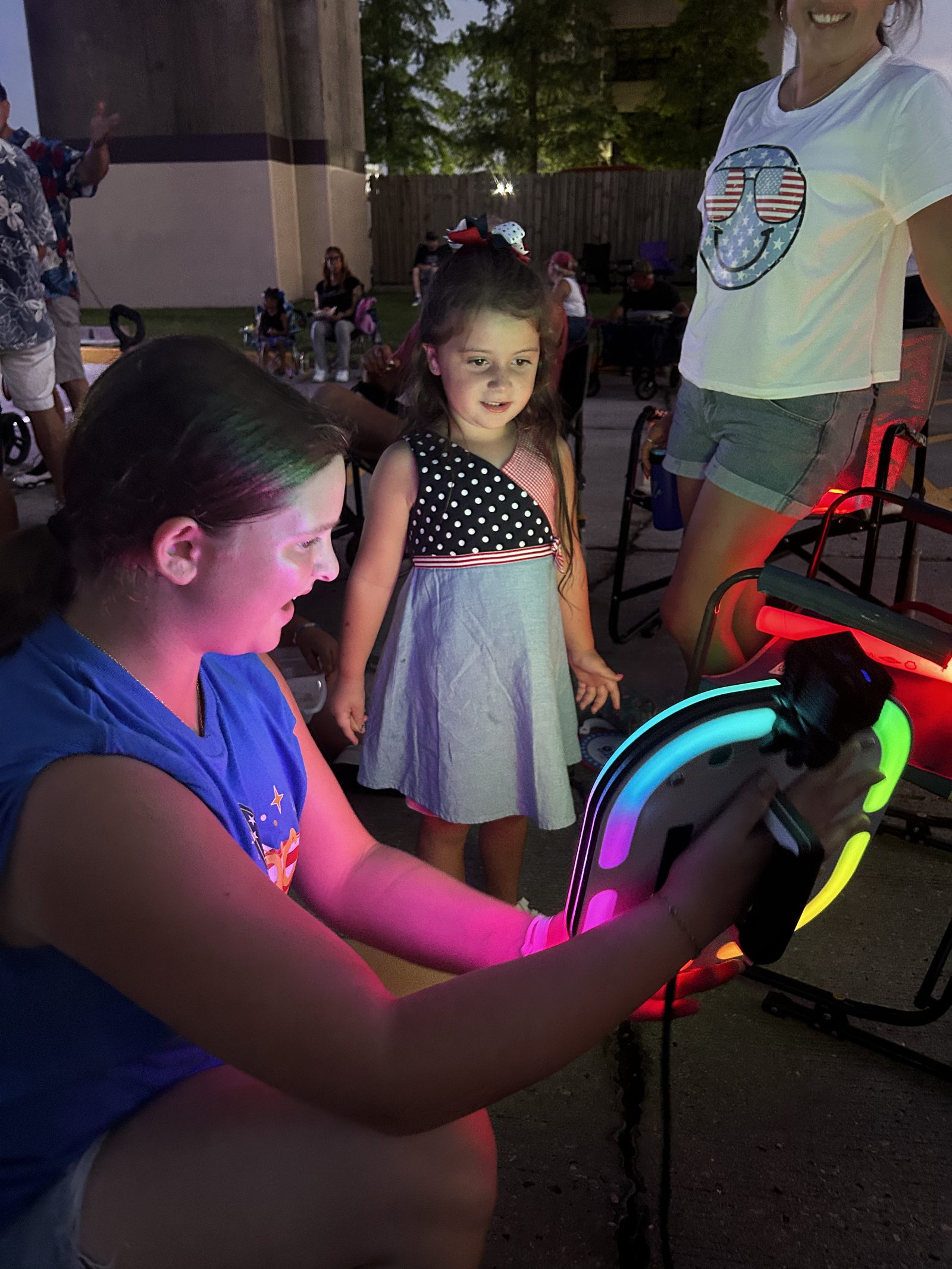 Young guest enjoying the Ramblin' Roamer mobile photo booth at a New Orleans family event